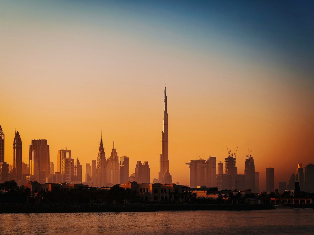 Dubai skyline at sunset across the water